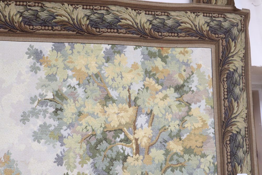 An Aubusson style machine woven hanging tapestry depicting a hunting party, with pole